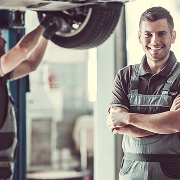 Man smiling in auto shop